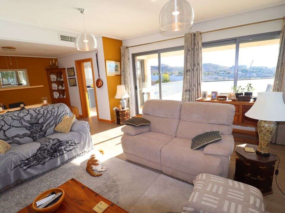 Elegant living room with large windows and scenic views in Aledo Murcia.