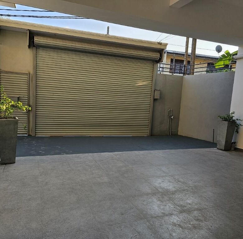 Spacious garage area in a luxury 12-bedroom condo building in Colombo, Sri Lanka. Modern design with.