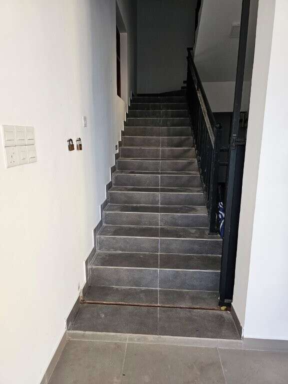 Spacious staircase inside a modern condo in Colombo, Sri Lanka.