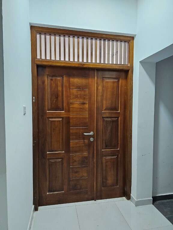 Elegant wooden door in luxury condo in Colombo.