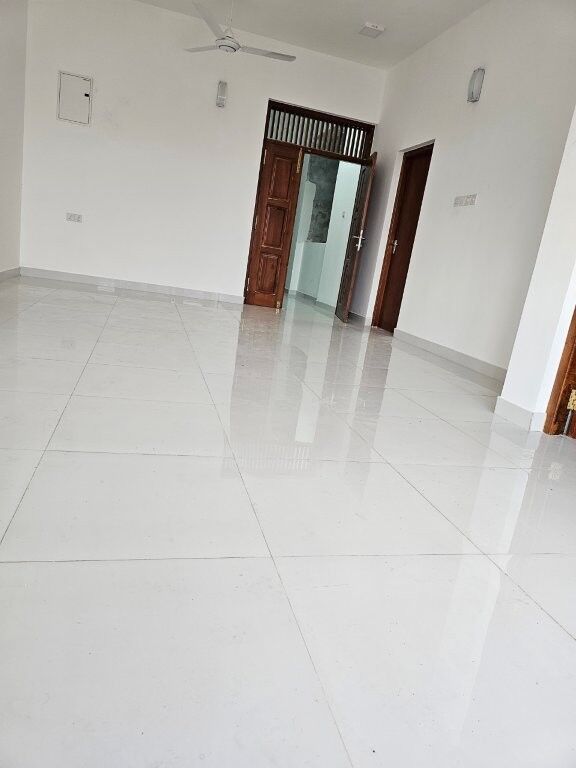 Spacious interior of a luxury 12-bedroom condo in Colombo, Sri Lanka, featuring modern design and hi.