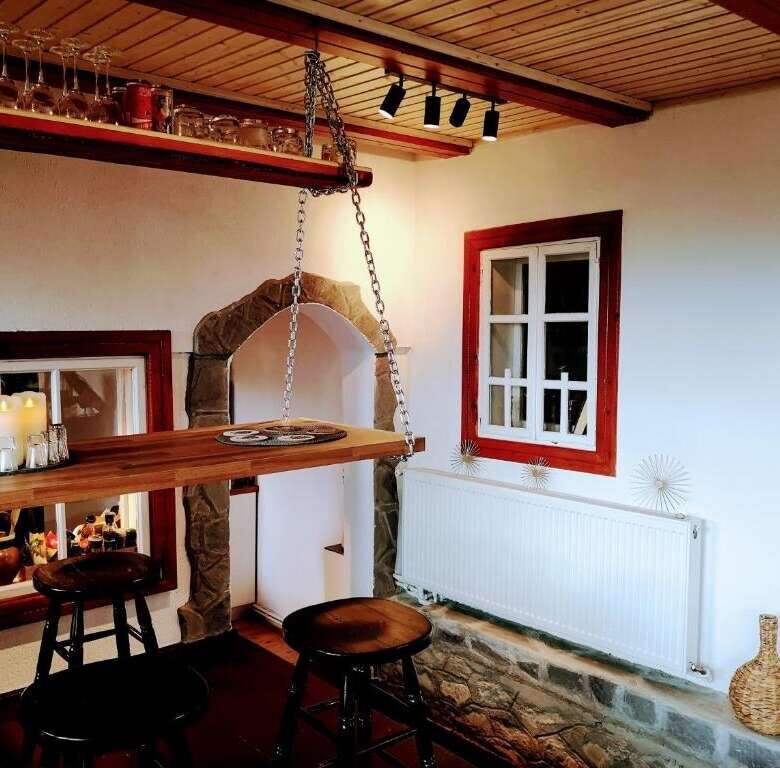 Cozy interior of a 4-bedroom house in Chiriteni with rustic wooden accents and charming decor.