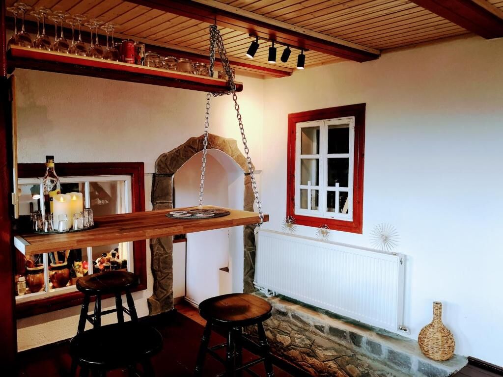 Cozy interior of a 4-bedroom house in Chiriteni with rustic wooden accents and charming decor.