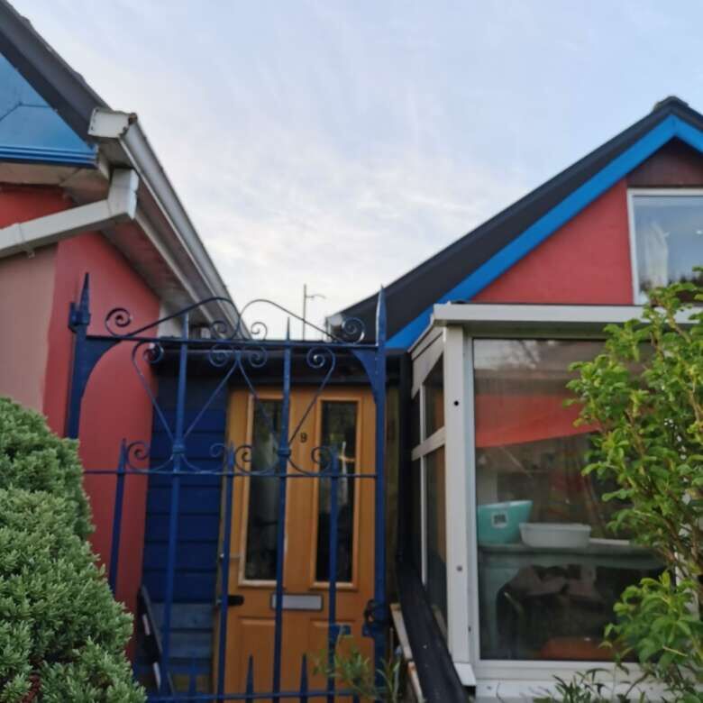 Beautiful home in Cloonagh, County Sligo, featuring vibrant exterior colors and lush greenery.