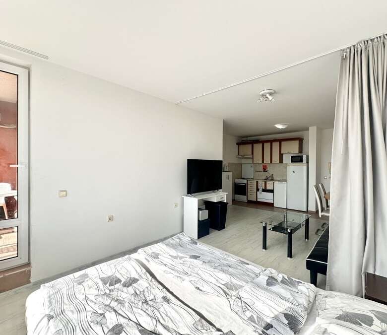 Spacious 56 sq.m. apartment with living area, kitchenette, and balcony in Nessebar Fort Club, Sunny.