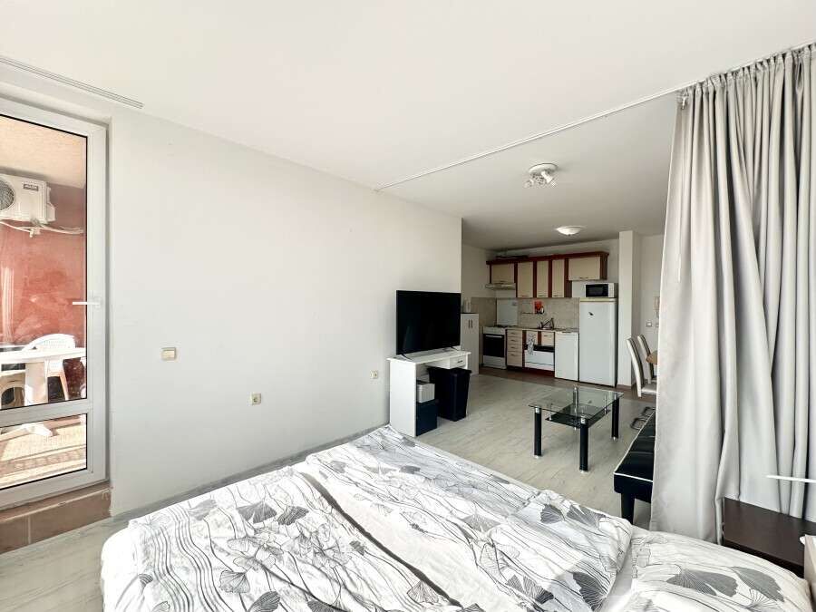 Spacious 56 sq.m. apartment with living area, kitchenette, and balcony in Nessebar Fort Club, Sunny.