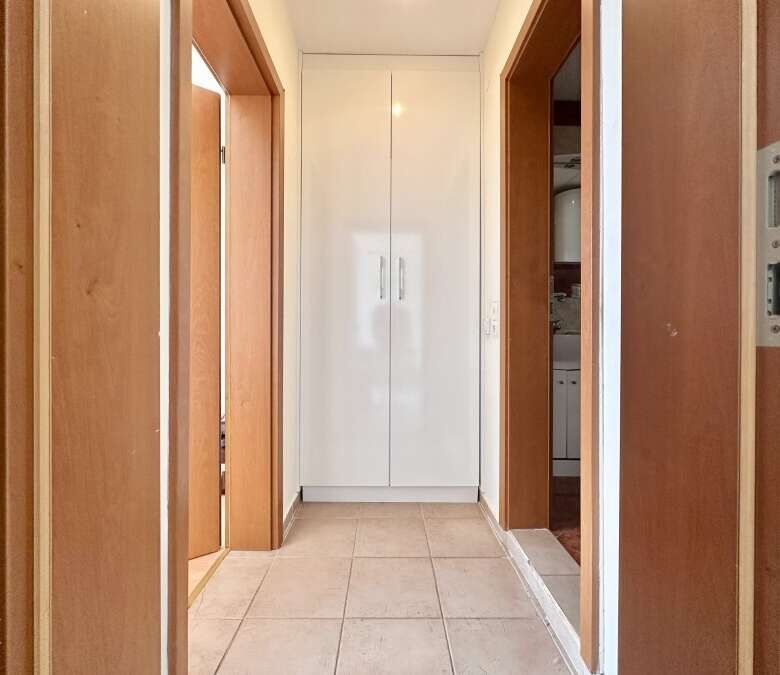 Interior view of a 1-bedroom apartment in Nessebar Fort Club, Sunny Beach, showing hallway and wardr.