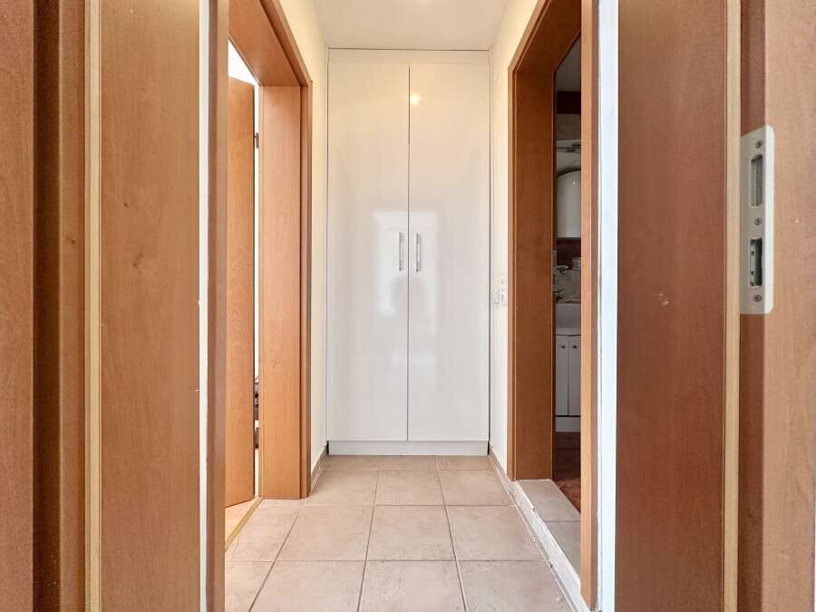 Interior view of a 1-bedroom apartment in Nessebar Fort Club, Sunny Beach, showing hallway and wardr.