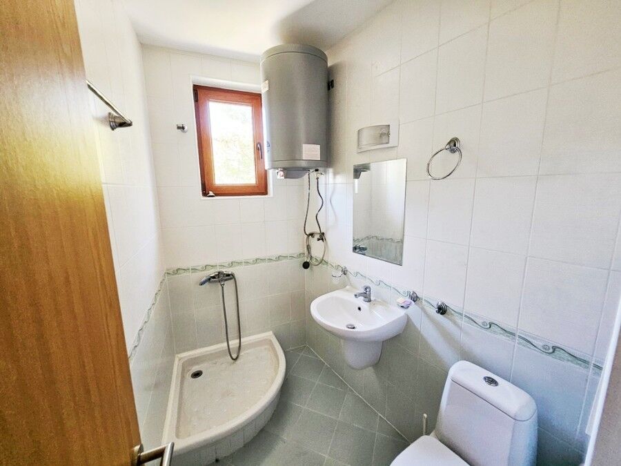 Bright bathroom with shower and water heater in Vineyards SPA Resort.