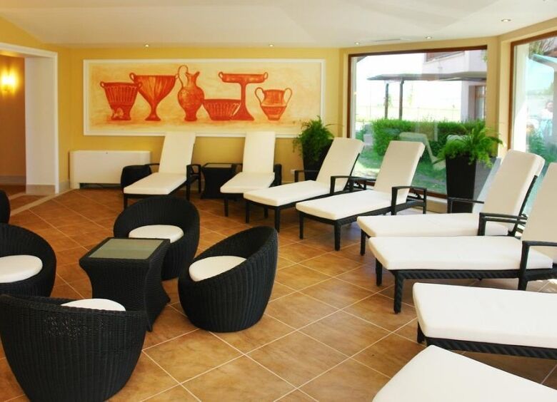 Pool view lounge with sunbeds and seating in Vineyards SPA Resort. Perfect for relaxation and enjoyi.