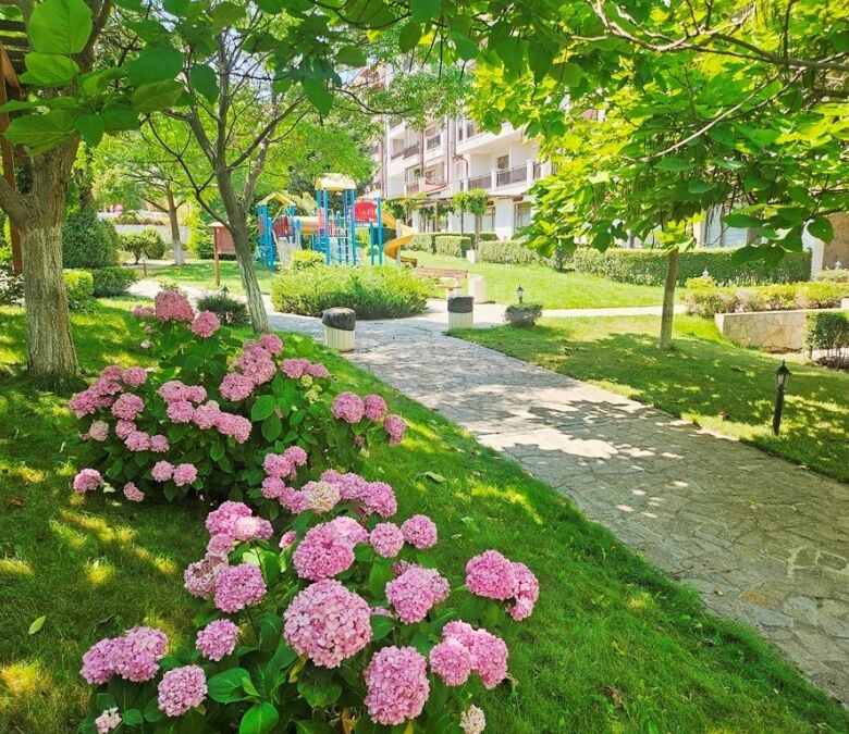 Beautiful garden with lush greenery and colorful flowers at Vineyards SPA Resort.