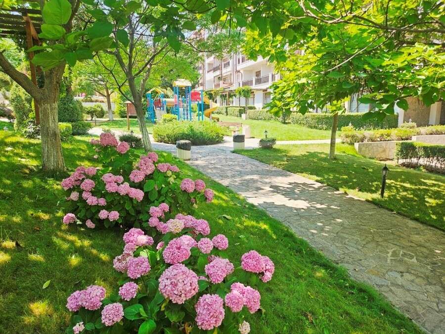 Beautiful garden with lush greenery and colorful flowers at Vineyards SPA Resort.