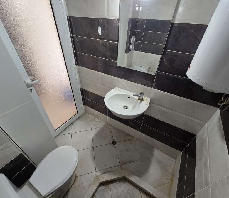 Bright bathroom with modern fixtures in Ravda center.