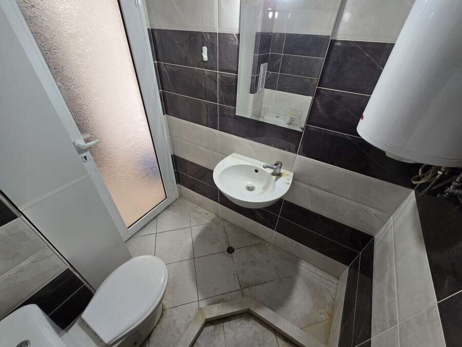Bright bathroom with modern fixtures in Ravda center.