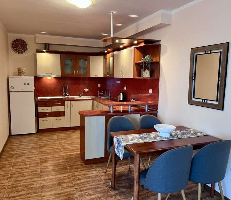 Spacious 60 sq.m. studio featuring pool views, modern kitchen, and comfortable dining area in St. Ni.