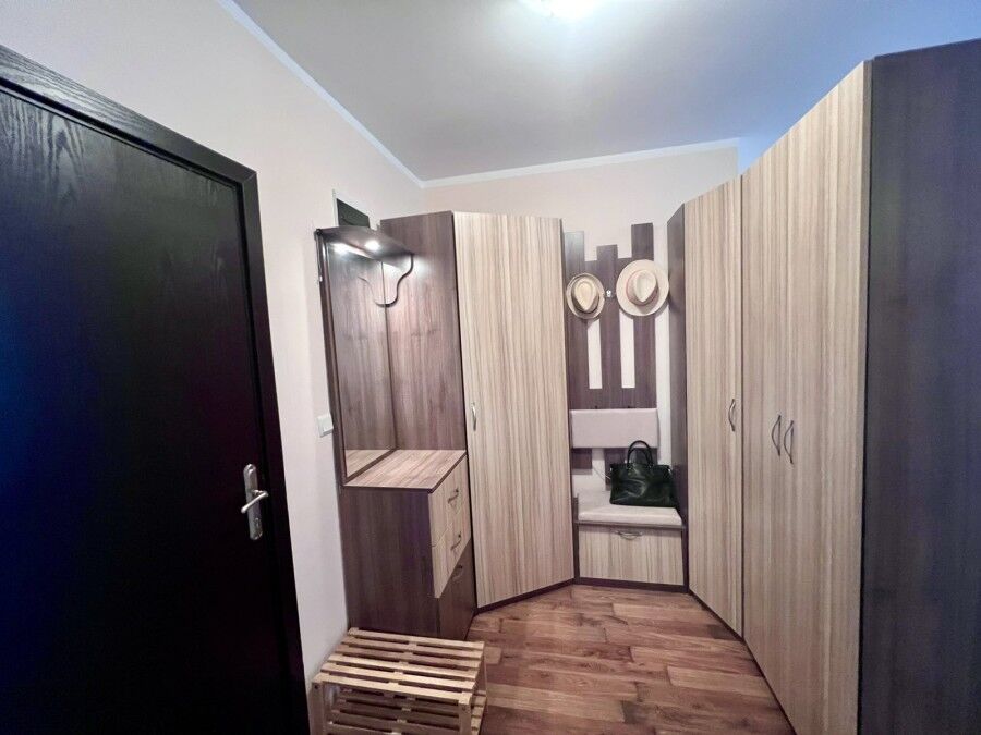Interior view of a spacious studio apartment with pool views in St. Nicola, Kosharitsa.