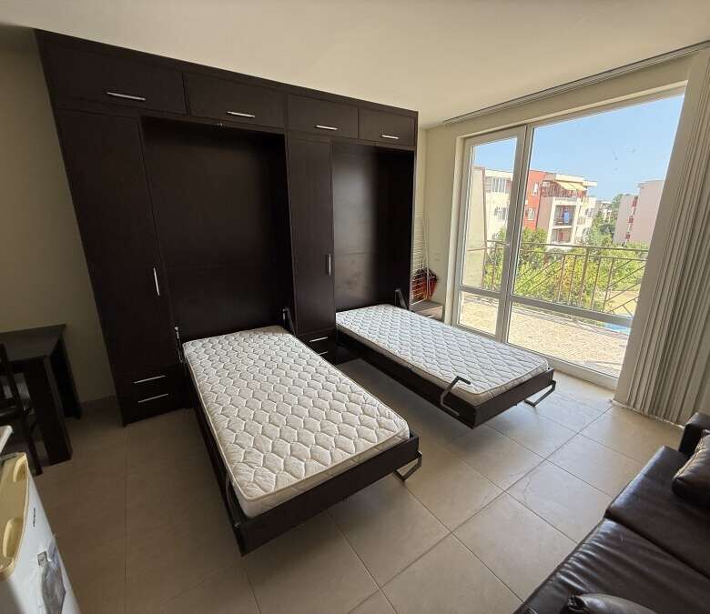 Bright studio apartment with two beds, overlooking pool and garden at Holiday Fort Club, Sunny Beach.