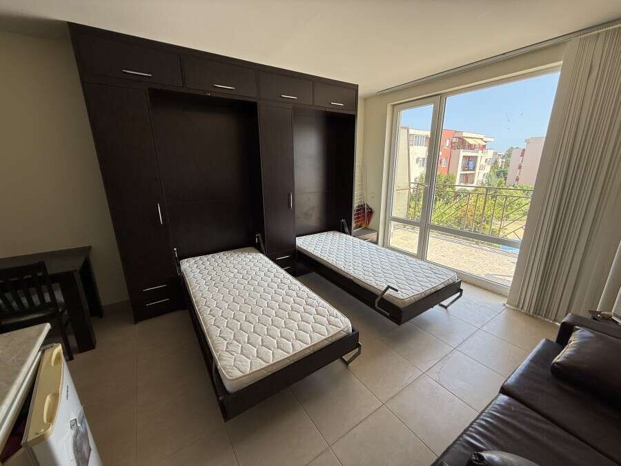 Bright studio apartment with two beds, overlooking pool and garden at Holiday Fort Club, Sunny Beach.