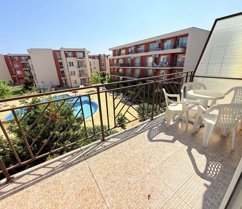 Balcony with garden and pool views in Sunny Beach holiday resort.