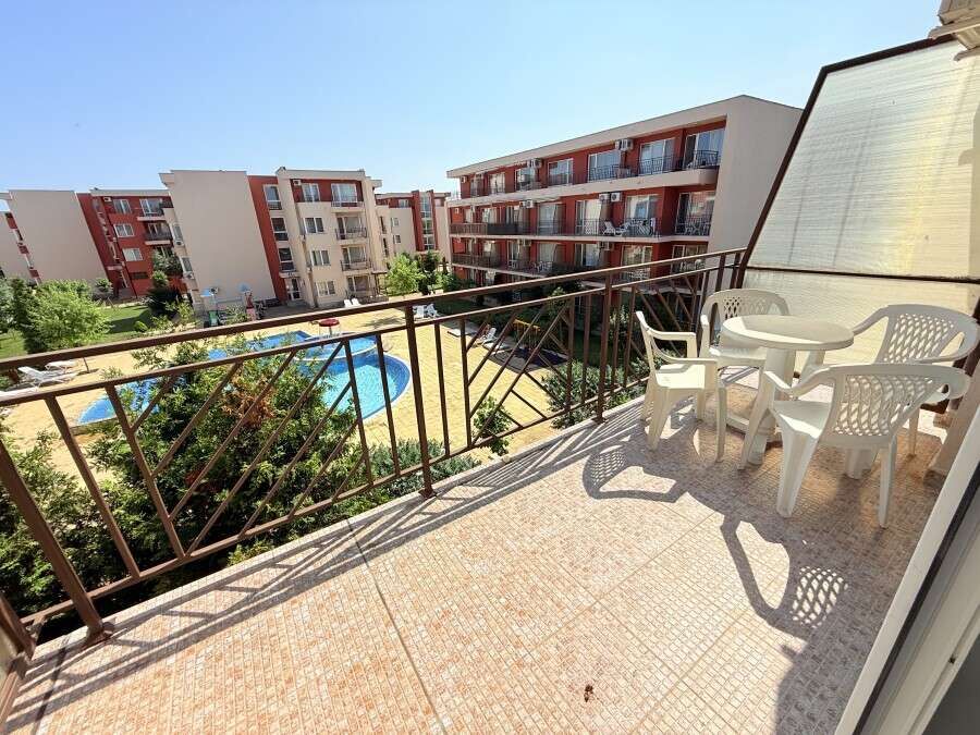 Balcony with garden and pool views in Sunny Beach holiday resort.