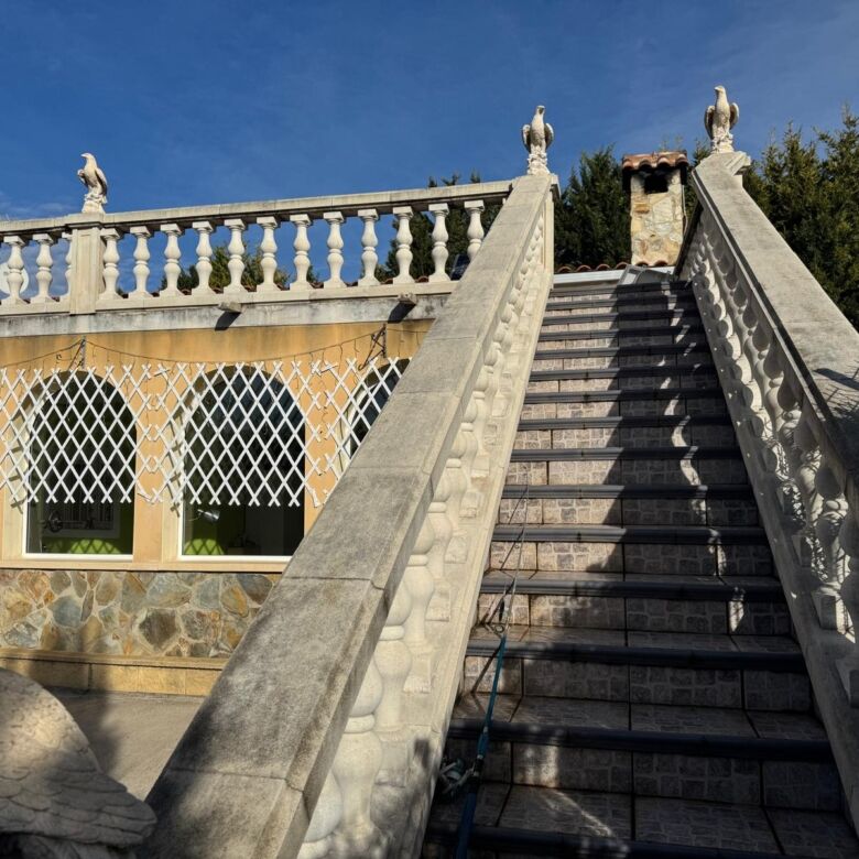 Stunning view of the ornate outdoor staircase leading to a luxurious villa in El Catllar Tarragona.