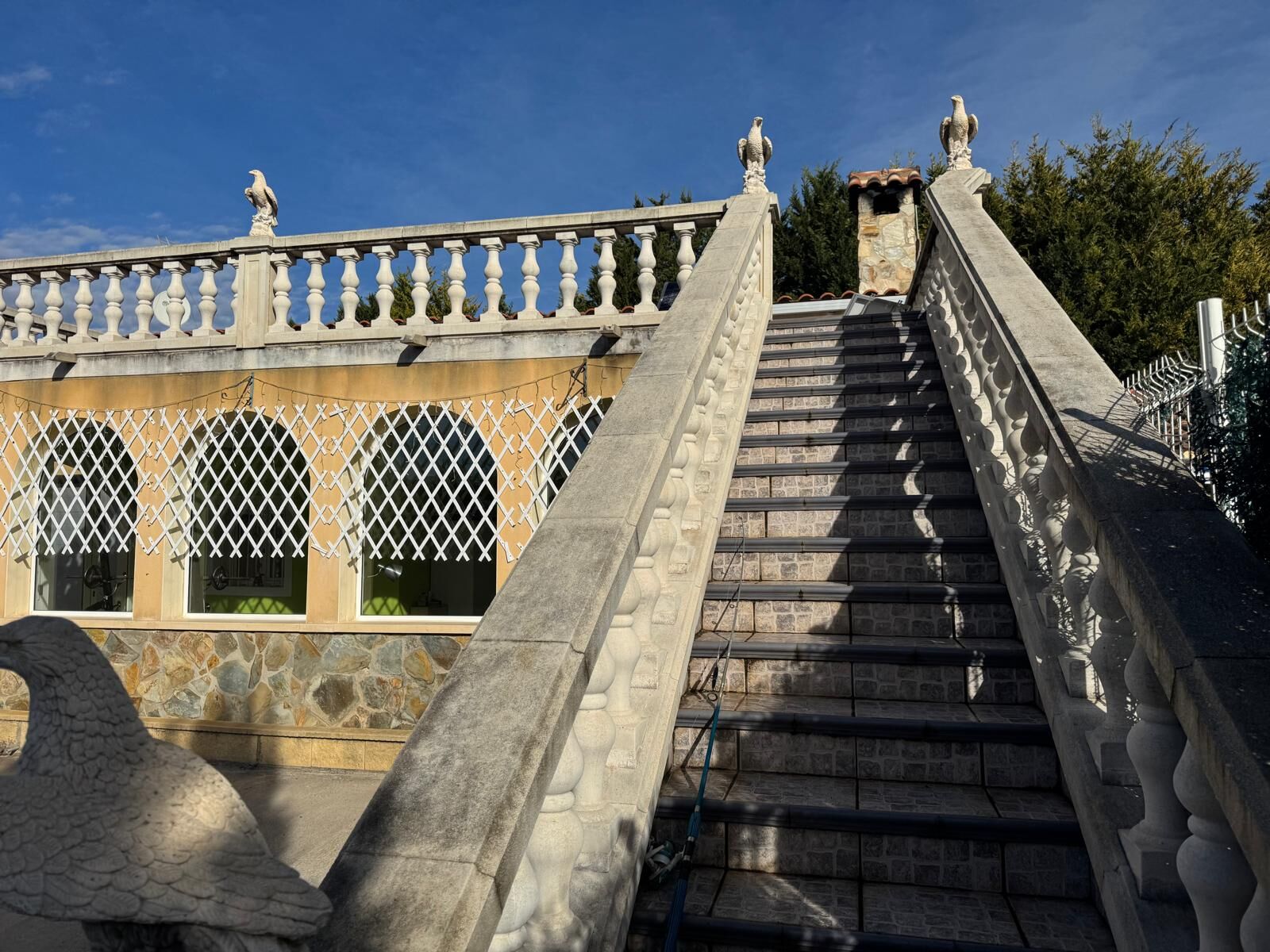 Stunning view of the ornate outdoor staircase leading to a luxurious villa in El Catllar Tarragona.