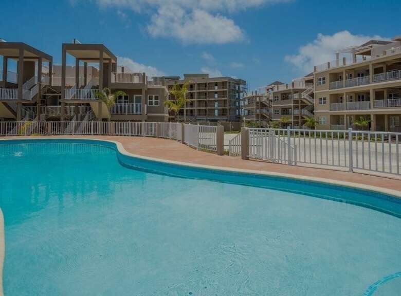Pool at Imperial Bay Residences, Saint with modern design and surrounding apartments.