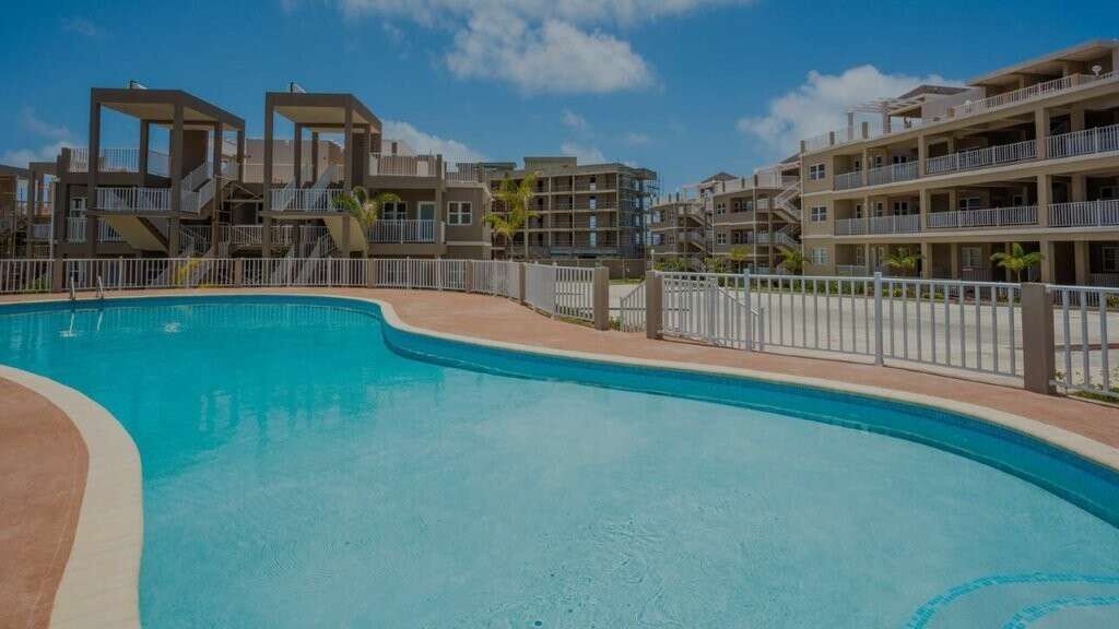 Pool at Imperial Bay Residences, Saint with modern design and surrounding apartments.