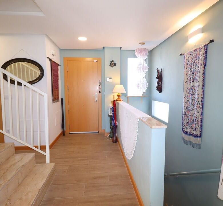 Elegant villa entrance in Aledo Murcia with bright interior and decorative curtains.