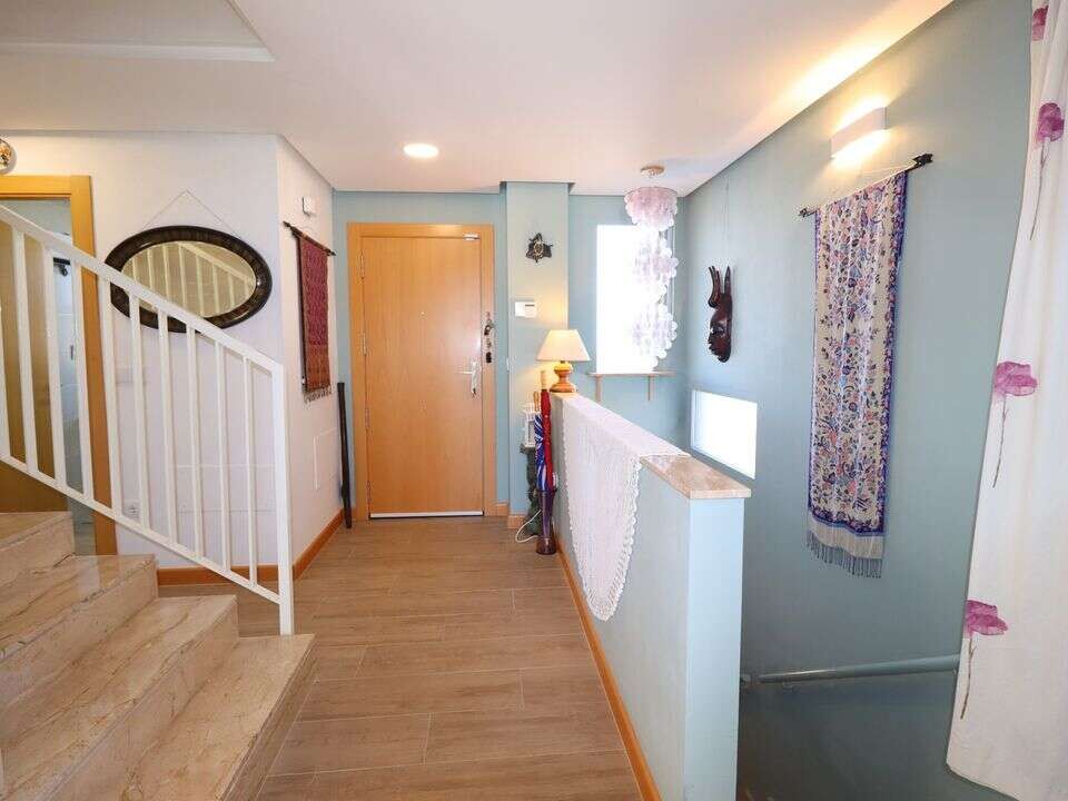 Elegant villa entrance in Aledo Murcia with bright interior and decorative curtains.