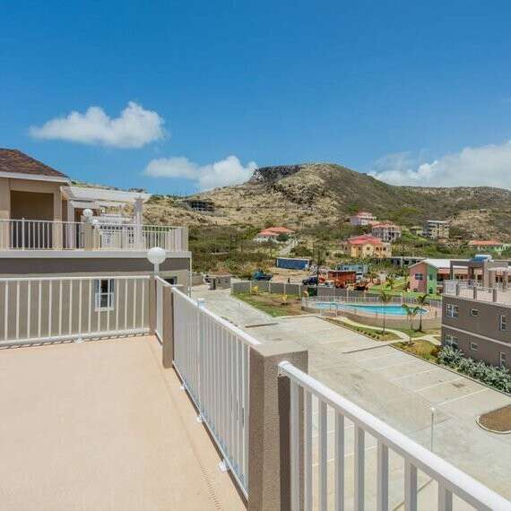 Beautiful view from the villa balcony overlooking the community and surrounding hills.