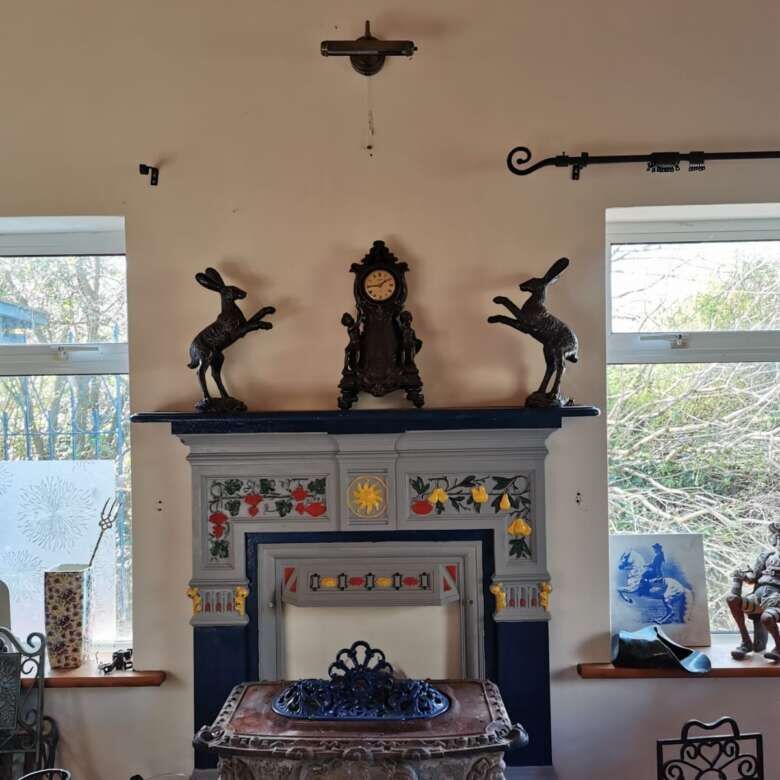 Cozy living room featuring antique fireplace and decorative ornaments, perfect for a warm home atmos.