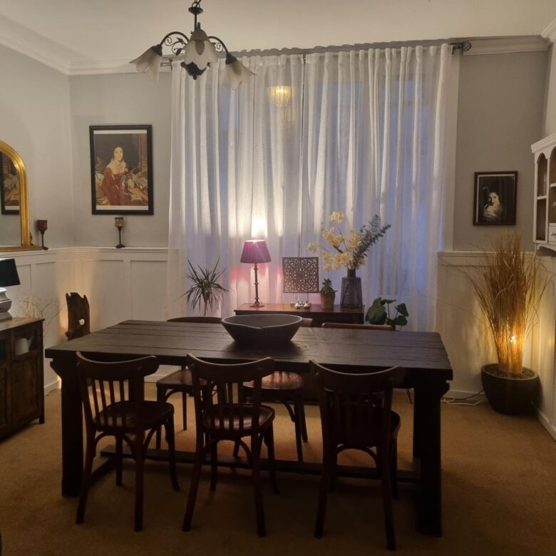 Elegant stone mansion dining room with classic decor and natural light. Perfect for luxurious living.