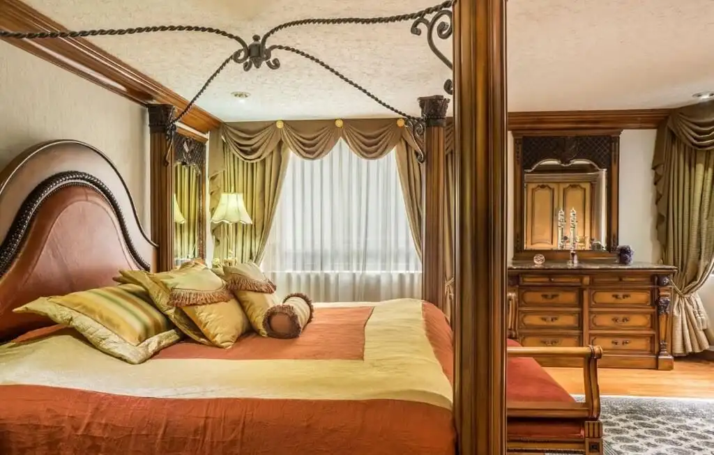 Elegant bedroom with classic decor in a luxury Mexico City apartment.
