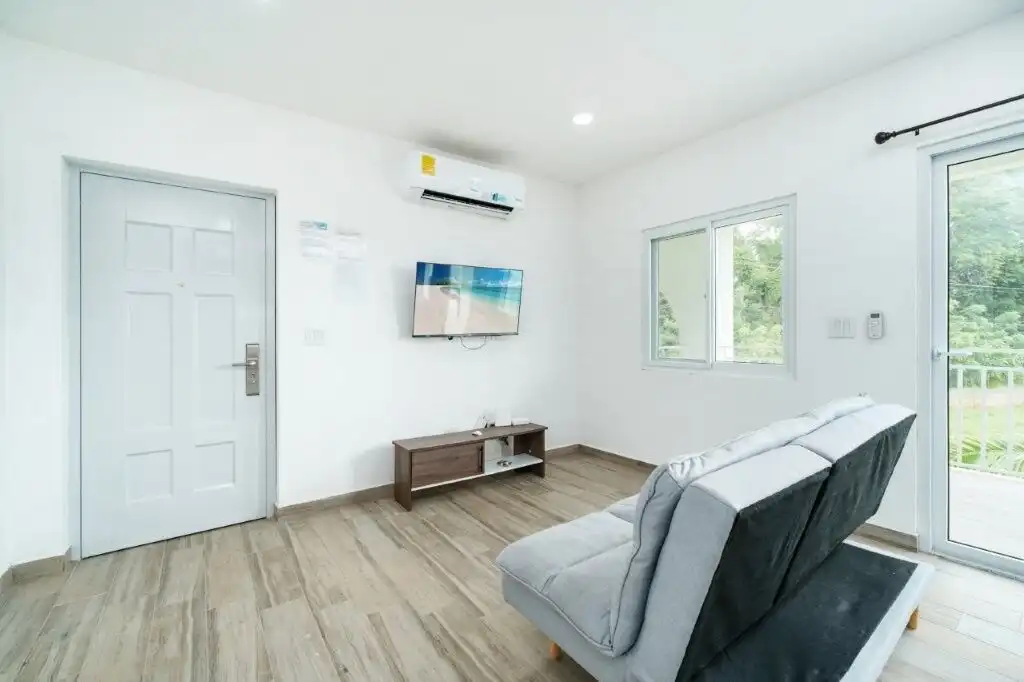 Modern condo living room with bright natural light and minimalist decor in Pedasi.