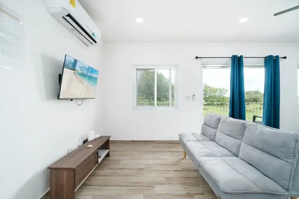 Bright living room in Ocean Waves Condo Resort for sale in Pedasi with modern furnishings and scenic.