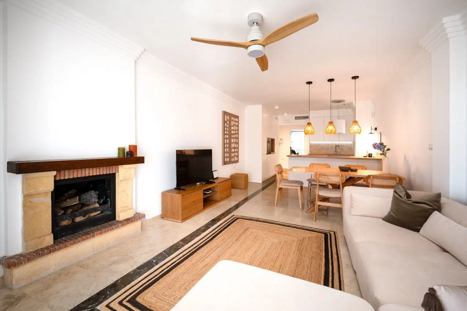 Bright Marbella apartment living room with modern furnishings and cozy ambiance.