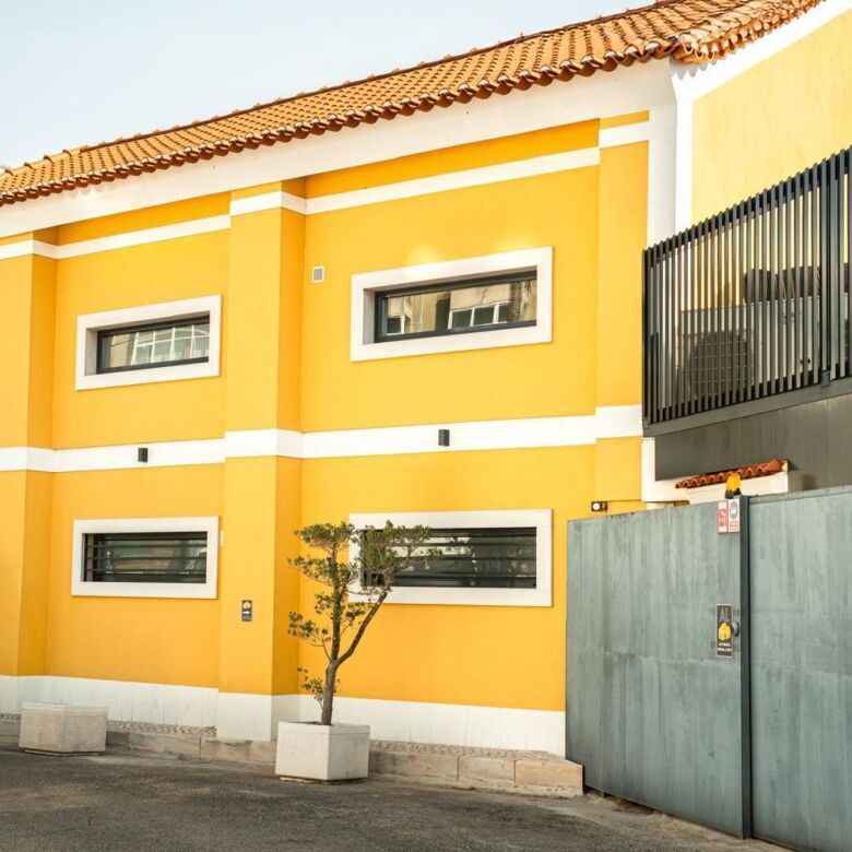 Bright yellow boutique hotel with modern design in Leiria, Portugal.