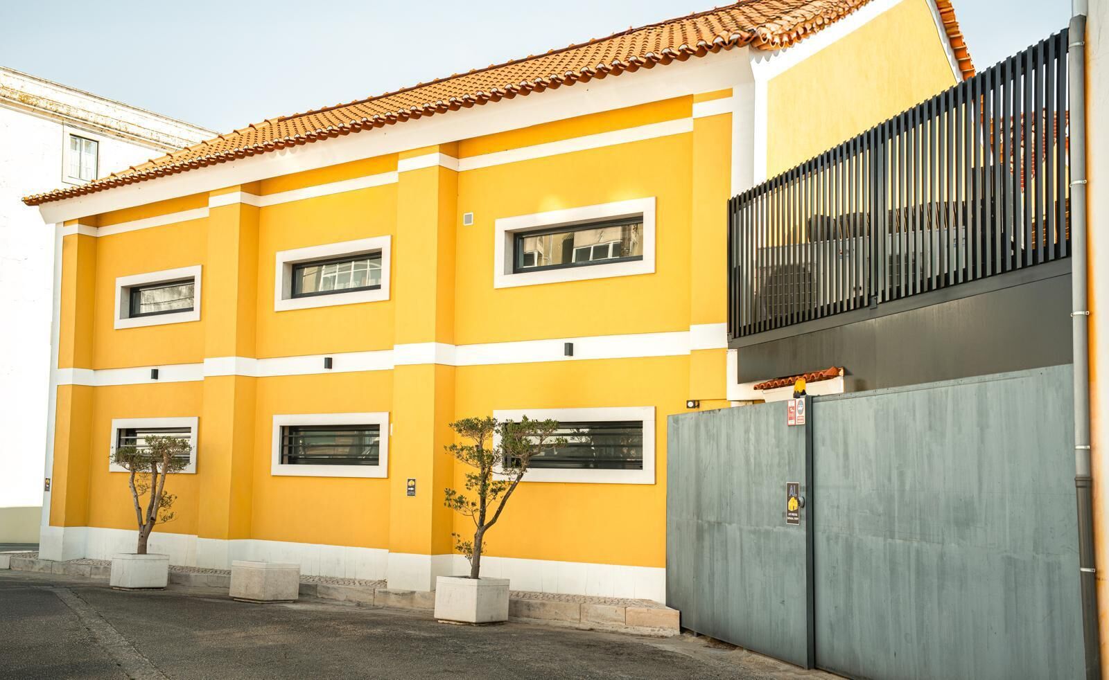 Bright yellow boutique hotel with modern design in Leiria, Portugal.