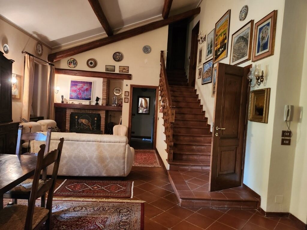 Luxury 5 Bed Country Villa Interior Spacious country villa with elegant decor, high ceilings, and traditional wooden staircase in Salsom.