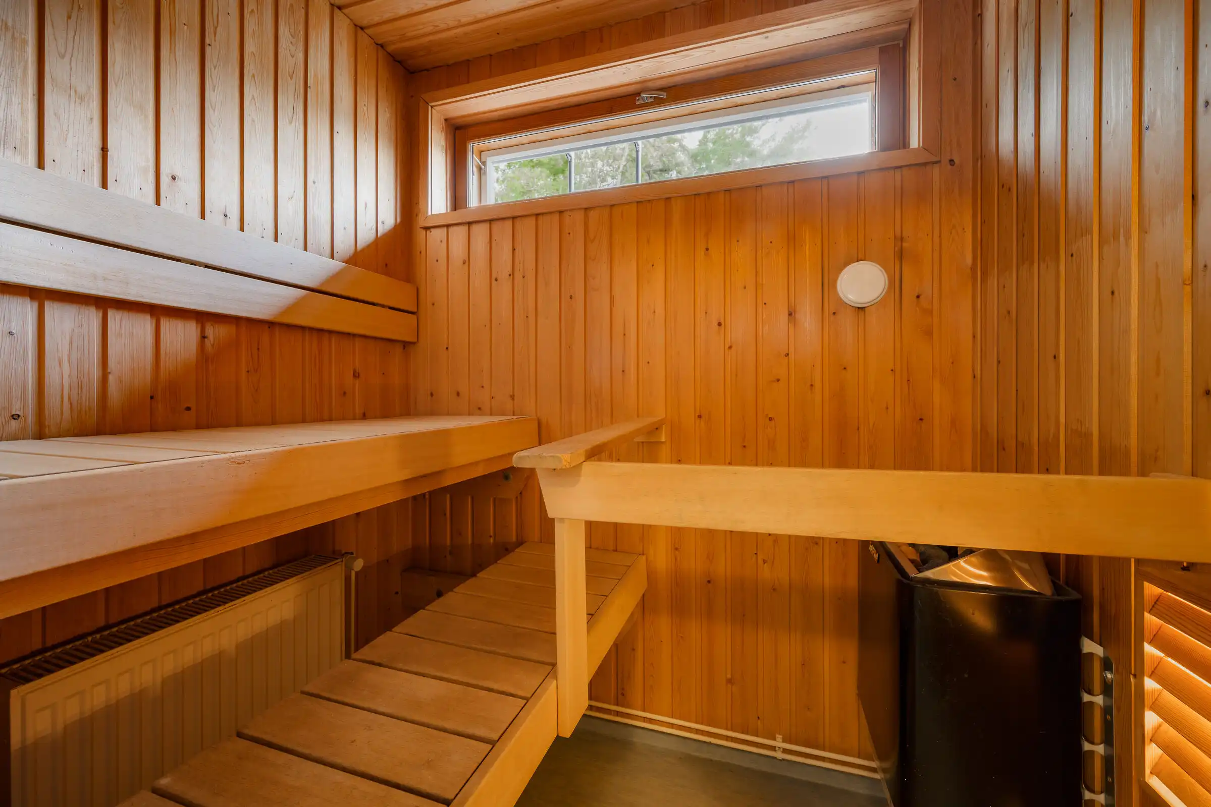 Cozy sauna with wooden interior in Hirvensalo, Turku, perfect for relaxation.