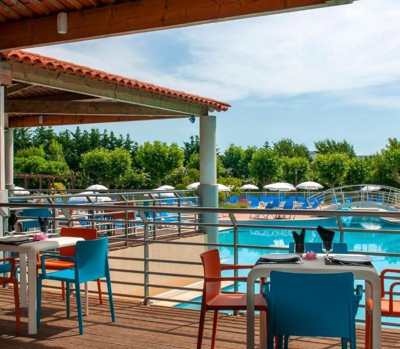Poolside terrace with seating area overlooking the swimming pool in Mandelieu La Napoule.