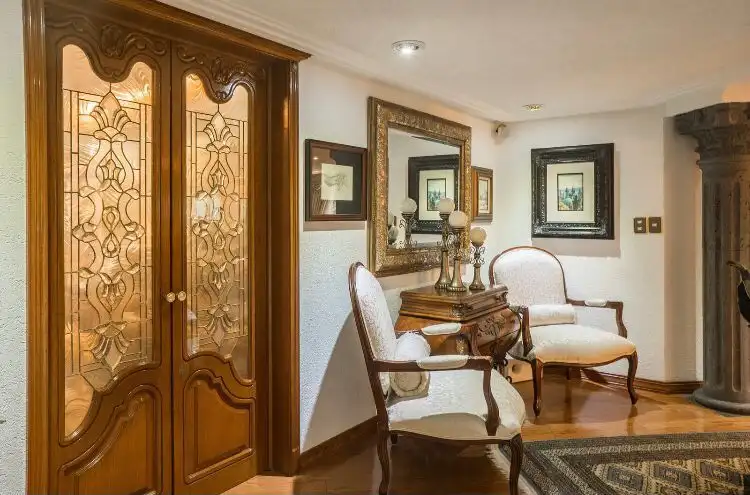 Elegant interior of a luxury apartment in Mexico City with classic furniture and decorative art.