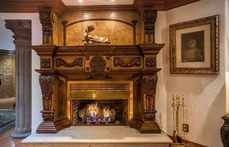 Elegant fireplace with ornate wooden mantel in a luxurious Mexico City apartment.
