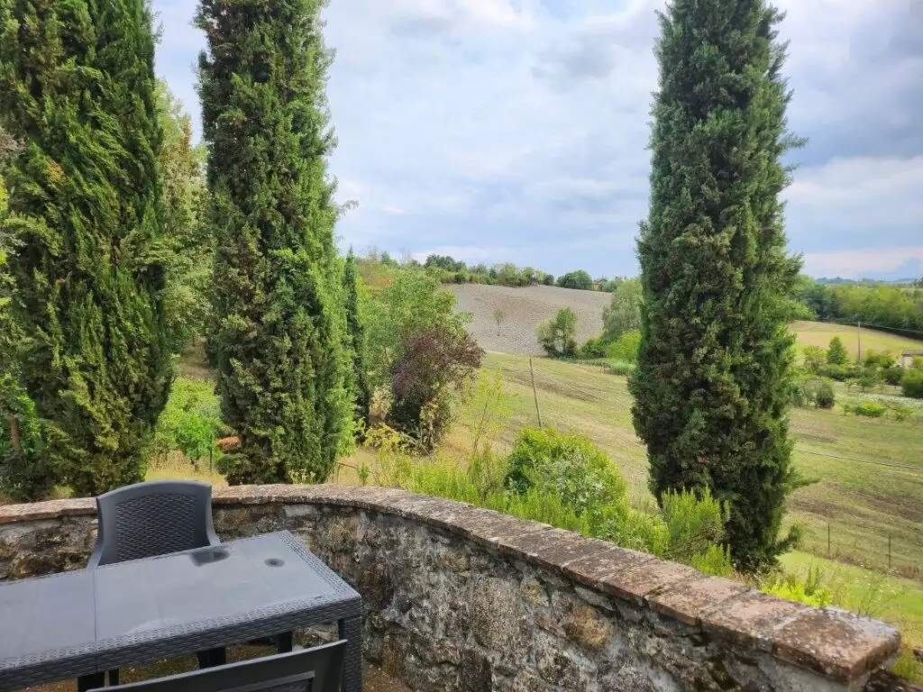 Elegant country villa with five bedrooms in Salsomaggiore Parma, surrounded by lush greenery and sce.
