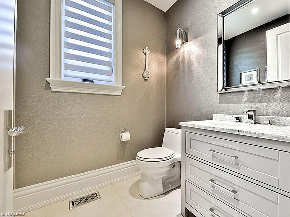 Luxury 6-bedroom villa bathroom in Oakville, Ontario. Modern fixtures, elegant design, and spacious.