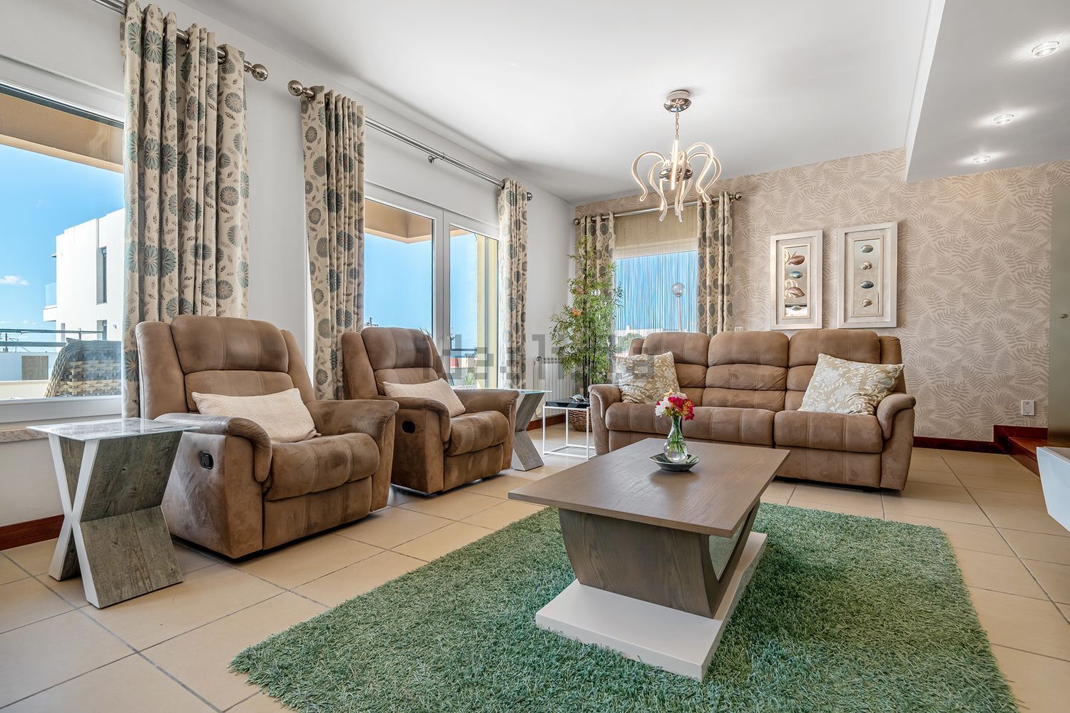 Luxury 3 Bed Villa For Sale In Santa Cruz Elegant living room with large windows and comfortable seating.
