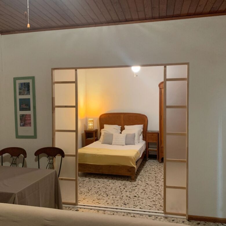 Spacious bedroom in La Paloma villa, Arles-sur-Tech, with elegant decor and comfortable furnishings.