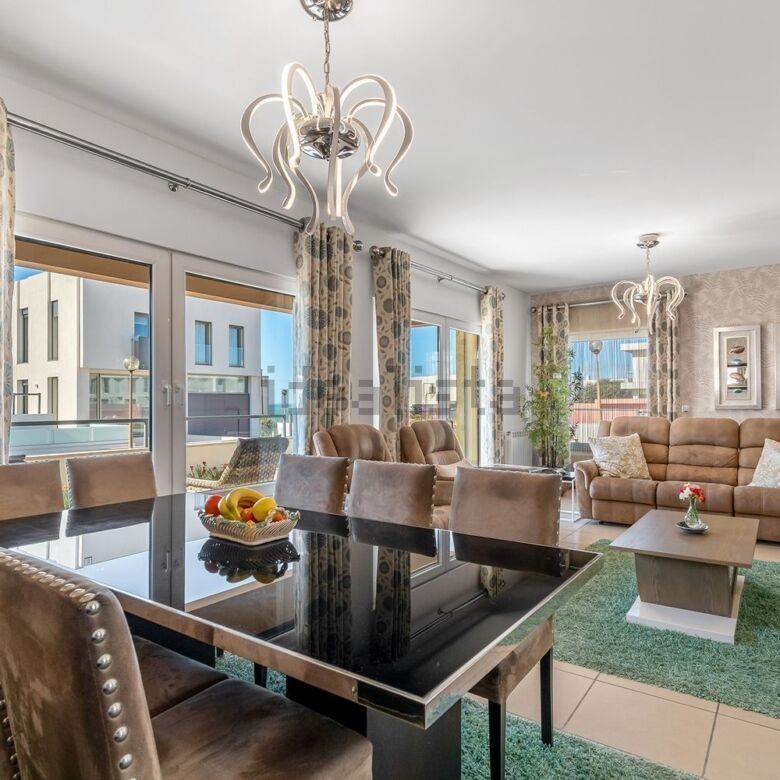 Spacious living room of a luxury 3-bedroom villa in Santa Cruz with modern decor and large windows.