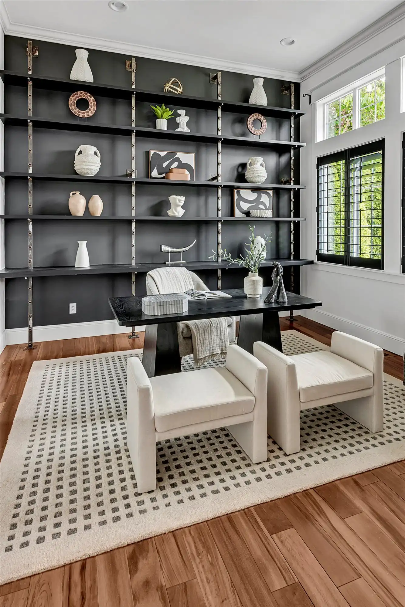 Luxury lakefront home with modern decor and stylish shelving. Bright, elegant space perfect for rela.